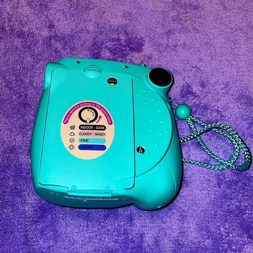 Instaxmini 7S Teal. Comes with film, and directions.